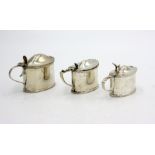 Three silver oval mustard pots, 6.4oz, each with blue glass liner.
