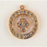 A very high purity gold pendant set with white stones, 4.1g.