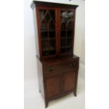 A mahogany secretaire bookcase, early 19th century, with a pair of glazed doors,