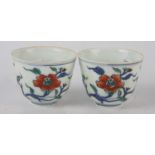 A pair of Chinese porcelain tea bowls, seal mark to base, height 5cm.