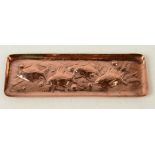 A Newlyn copper pen tray, decorated with four fish, impressed Newlyn, 7.7 x 23.1cm.