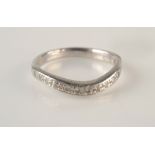 A platinum diamond set half hoop ring, 3.1g.