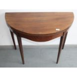 A George lll mahogany demi-lune tea table, with square tapering legs, height 73cm, width 92cm.