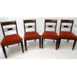 A set of four mahogany dining chairs, early 19th century, each with a horizontal bar splat,