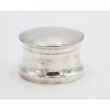 A plain filled silver powder bowl and cover.