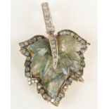 A diamond and agate pendant with carved central leaf bordered by a row of diamonds and with diamond