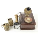 A wall mounted telephone, with brass mouthpiece and earphone, the mouthpiece stamped S25/4001 No.