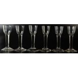 A set of six 18th century English cordial glasses of plain form with slightly tapering heavily