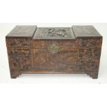 A Chinese carved camphor wood chest, early 20th century, height 47cm, width 94 cm, depth 45 cm.