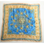 A Pierre Balmain silk scarf, blue and gold design, 90 x 90cm.