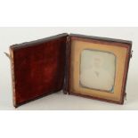 An early Victorian Daguerreotype portrait photograph of a gentleman, in a brown leather case, 9 x 7.