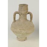 A Mediterranean pottery vase, twin handled, with traces of original brown painted decoration,