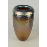 A Norman Stuart Clarke tall iridescent vase with everted rim, height 26.5cm.