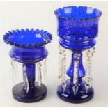 Two Victorian blue glass table lustres, heights 32cm and 24cm.
