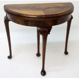 A George III style mahogany demi lune card table,
