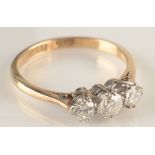 An 18ct gold three stone diamond ring. Condition report: 18 ct 2.2gms Size K + ½.