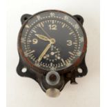 A German WWII ME 109 aircraft cockpit clock, 7.5 x 6.5cm.