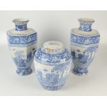 An English blue and white Japonaiserie printed three vase garniture,