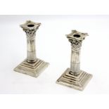 A pair of Mappin & Webb silver Corinthian column candlesticks.