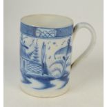 An 18th century blue and white earthenware cylindrical mug, with lakeside pagodas, height 11.