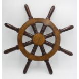 An oak eight spoke ships wheel, diameter width 56cm.