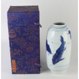 A Japanese blue and white porcelain vase, 20th century, decorated with carp, complete with box,