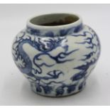 A Ming style squat baluster blue and white dragon decorated jar, height 14cm.