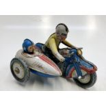 A tin plate clockwork motorbike and sidecar, length 18cm.