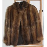 A ladies brown fur coat by M & Michaels Furs of Bristol,