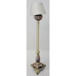 An unusual yellow painted metal and porcelain standard lamp, height 157cm.