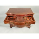 A fine George III mahogany serpentine gentleman's dressing chest,