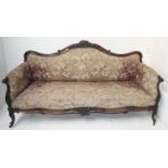 A large early Victorian rosewood sofa, the floral decorated paddedback, arms and seat,