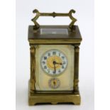 A good French gilt brass cased alarm carriage clock,