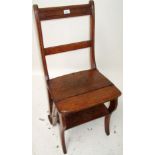 An Edwardian oak metamorphic library chair, with arcaded top rail, folding seat,