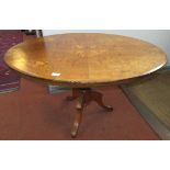 A Victorian inlaid walnut breakfast table.