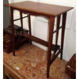 An Arts and Crafts walnut side table, with a rectangular top, above a flattened lower stretcher