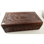 An African Belgian Congo carved box, carved with animals, figures and trees, height 22cm,