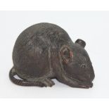 A Japanese carved wood okimono in the form of a mouse, 19th century, with horn inlaid eyes,