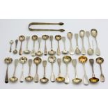Various silver condiment spoons and a pair of silver sugar tongs, 11.3oz.