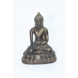 A bronze figure of a seated buddha, height 13.3cm.