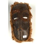 A Papua New Guinea carved wood mask, 43.5 x 21cm.