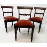 A set of three mahogany dining chairs, early 19th century, each with a carved horizontal bar splat,