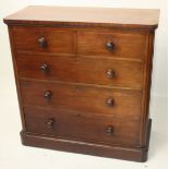 A Victorian mahogany chest of drawers, with two short and three long drawers on a plinth base,