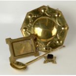 A Dutch brass octagonal wall sconce back plate, 34cm square, a brass spoon, length 47.