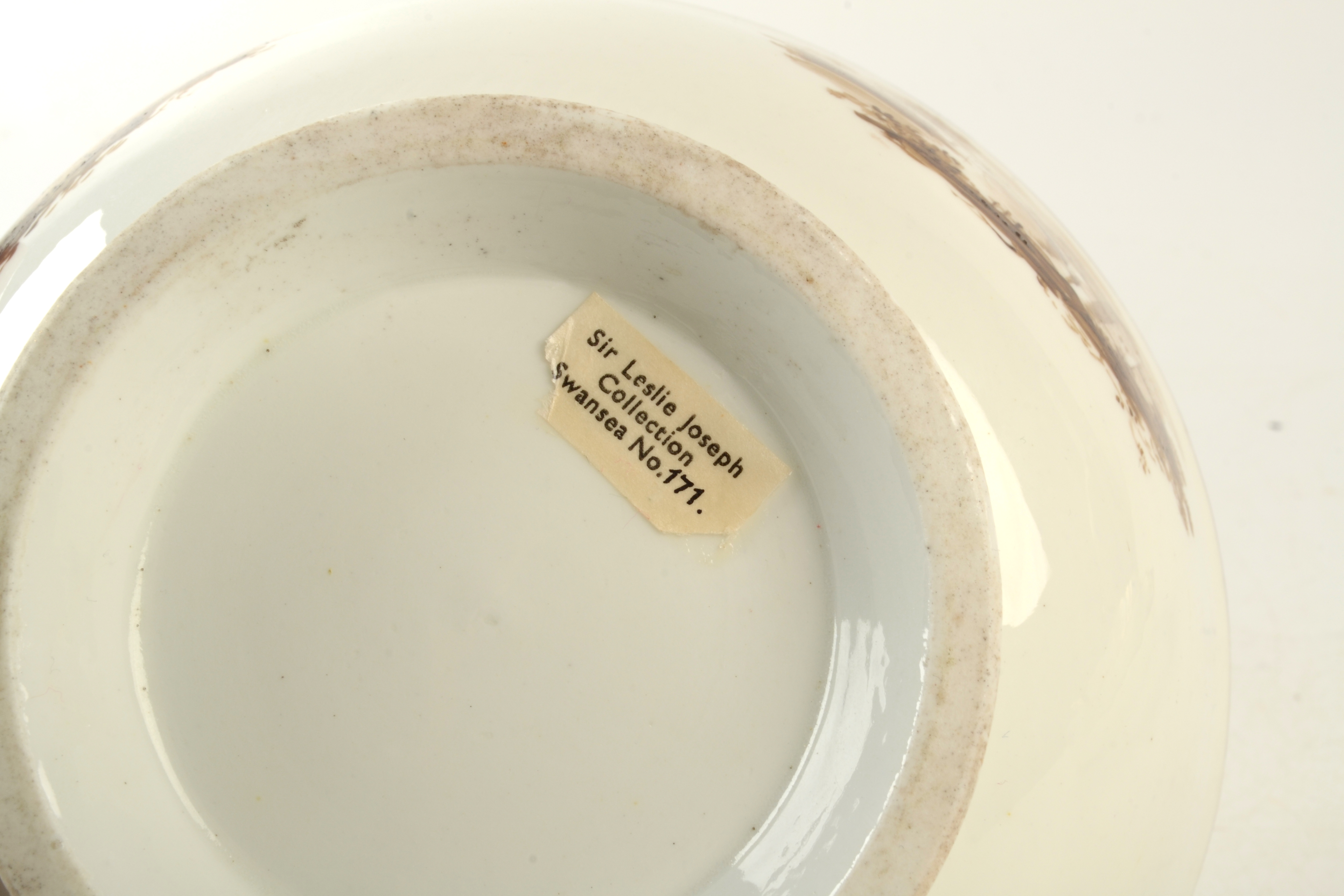 An 18th century Swansea porcelain bowl painted with three sepia landscape vignettes, - Image 4 of 4