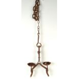 An iron suspended twin pricket candle holder, maximum drop 123cm.