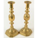 A pair of Victorian 'King of Diamonfs' brass candlesticks,