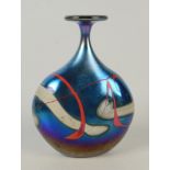 A Norman Stuart Clarke iridescent glass vase, of flattened form, with broad circular rim,