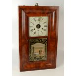 An American walnut wall clock, circa 1900, with paper label inscribed 'manufactured by Jerome & Co,
