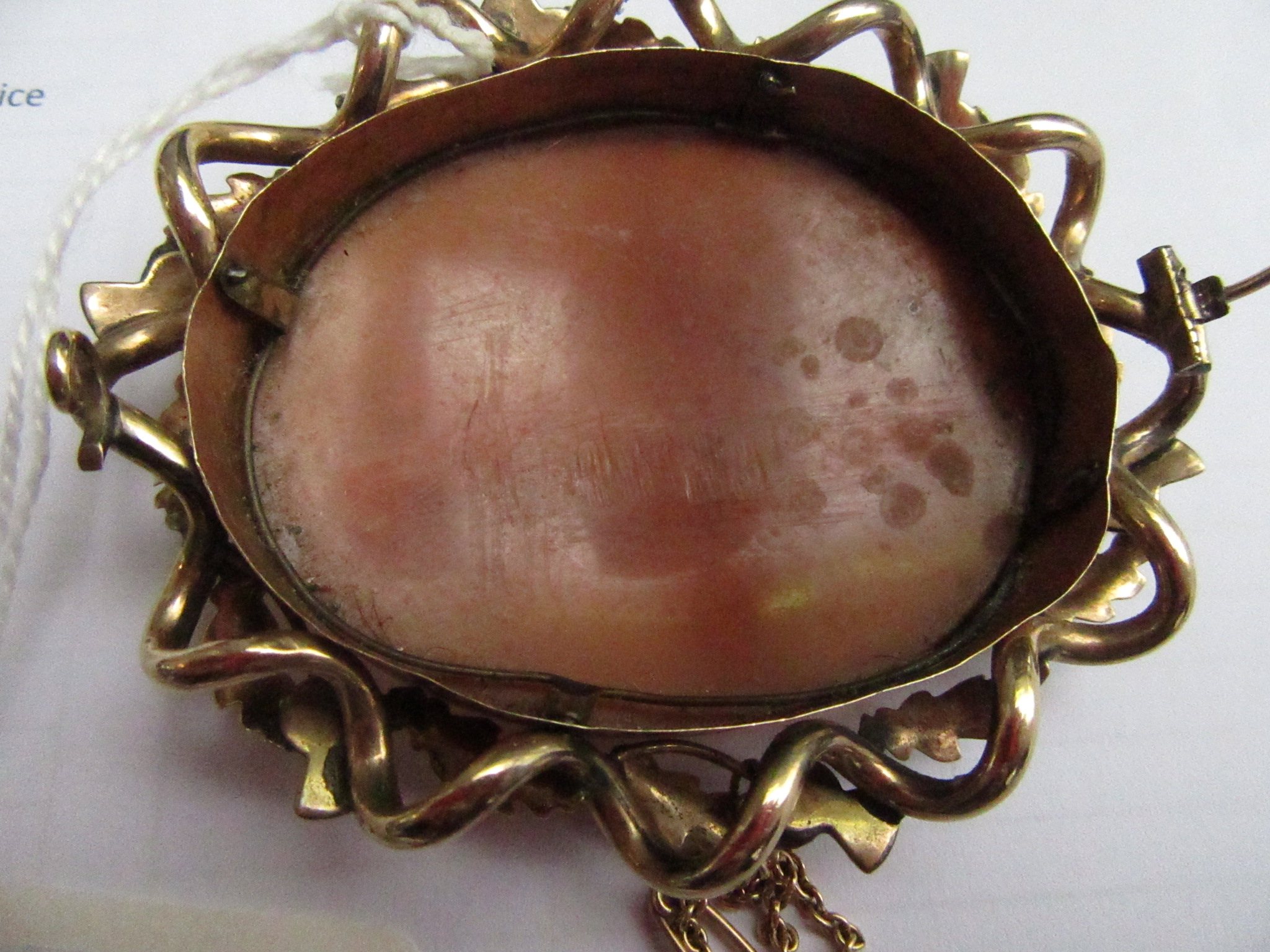 A 19th century large oval cameo brooch showing wild horses and mythical figures in a gold thistle - Image 2 of 2